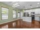 The eat-in kitchen area features access to the back door, and stainless appliances at 1109 Renewal Pl, Raleigh, NC 27603