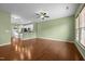 Spacious living room featuring wood floors, a ceiling fan, and neutral paint at 1109 Renewal Pl, Raleigh, NC 27603
