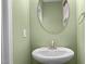 A half bathroom has neutral paint and a white sink at 1109 Renewal Pl, Raleigh, NC 27603
