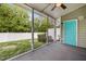 A screened porch offers shade and a view of the fenced backyard at 1109 Renewal Pl, Raleigh, NC 27603