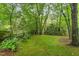 Private backyard features lush greenery, a garden, and a tranquil view at 111 Murdock Creek Ct, Cary, NC 27519