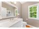 Updated bathroom featuring a white vanity, new fixtures and natural light at 111 Murdock Creek Ct, Cary, NC 27519