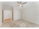 Carpeted bedroom with a ceiling fan, neutral walls, and double closets at 111 Murdock Creek Ct, Cary, NC 27519
