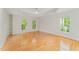 Spacious bedroom with gleaming hardwood floors, tray ceiling, and plenty of light at 111 Murdock Creek Ct, Cary, NC 27519