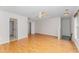 Open living room with hardwood floors, a ceiling fan, and two doorways at 111 Murdock Creek Ct, Cary, NC 27519
