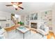 Cozy living room with fireplace, built-in bookshelves, and lots of natural light at 111 Murdock Creek Ct, Cary, NC 27519