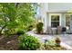 Private back patio with lush greenery, ideal for enjoying a peaceful outdoor retreat at 111 Sir Richard Ln, Chapel Hill, NC 27517
