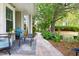 Cozy backyard patio with comfortable seating and a serene garden path, ideal for relaxation and enjoying nature at 111 Sir Richard Ln, Chapel Hill, NC 27517