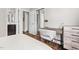 Bedroom featuring a work space, hardwood floors, and a view of a bathroom through the entry to an adjacent room at 111 Sir Richard Ln, Chapel Hill, NC 27517