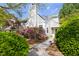 Charming home with beautiful landscaping and flowering bushes enhancing its curb appeal at 111 Sir Richard Ln, Chapel Hill, NC 27517