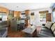 Open kitchen featuring stainless steel appliances, a kitchen island with breakfast bar, and an adjacent living area at 111 Sir Richard Ln, Chapel Hill, NC 27517