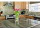 Close-up kitchen island with granite countertops and stainless steel appliances at 111 Sir Richard Ln, Chapel Hill, NC 27517