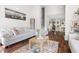 Cozy living room with a comfortable sofa, decorative rug, and staircase in view at 111 Sir Richard Ln, Chapel Hill, NC 27517