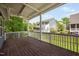 This backyard view showcases the covered deck and the landscaped backyard at 11808 Venture Oak Way, Raleigh, NC 27613