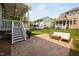 This view of the back patio highlights an outdoor living space with green backyard at 11808 Venture Oak Way, Raleigh, NC 27613