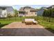 This view showcases the home's back patio and seating with landscaped yard at 11808 Venture Oak Way, Raleigh, NC 27613