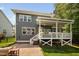 This back yard features a new patio and landscaped yard at 11808 Venture Oak Way, Raleigh, NC 27613