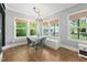 Bright breakfast nook features hardwood floors, natural light, and modern furnishings at 11808 Venture Oak Way, Raleigh, NC 27613