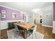 Charming dining room with modern table, decor, and hardwood flooring at 11808 Venture Oak Way, Raleigh, NC 27613