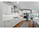Well-equipped kitchen with stainless steel appliances, white cabinetry, and ample counter space at 11808 Venture Oak Way, Raleigh, NC 27613