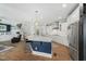 Bright kitchen features a large island, stainless steel appliances, and ample counter space at 11808 Venture Oak Way, Raleigh, NC 27613