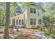 Charming exterior view of the home featuring a brick patio, manicured landscaping, and inviting outdoor space at 1203 Queensbury Cir, Durham, NC 27713