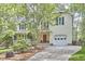 Charming two-story home with a welcoming front porch and a well-maintained lawn at 1203 Queensbury Cir, Durham, NC 27713