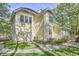 Well-maintained home exterior with a lush yard, stone pathway, and inviting landscaping at 1203 Queensbury Cir, Durham, NC 27713