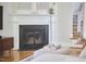 Elegant fireplace with decorative mantel and modern accents in a cozy living room setting at 1203 Queensbury Cir, Durham, NC 27713