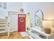 Bright foyer featuring hardwood floors, a staircase, and stylish decor creating a welcoming entry at 1203 Queensbury Cir, Durham, NC 27713