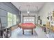 Finished game room with a pool table and a garage door, perfect for entertaining at 1203 Queensbury Cir, Durham, NC 27713