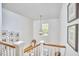 Bright foyer with an open staircase and modern decorations at 1203 Queensbury Cir, Durham, NC 27713