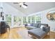 Bright living room with access to the backyard and plenty of windows for natural light at 1203 Queensbury Cir, Durham, NC 27713