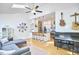 Open living space with kitchen, a grand piano, and comfortable seating, great for gatherings at 1203 Queensbury Cir, Durham, NC 27713