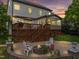 Outdoor backyard featuring a deck and a fire pit area with comfortable seating at 1209 Kingston Ridge Rd, Cary, NC 27511