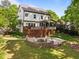 Backyard with deck and a fire pit perfect for outdoor entertainment at 1209 Kingston Ridge Rd, Cary, NC 27511