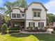 Beautiful two-story home with a well-manicured lawn and a cozy front porch, perfect for relaxing at 1209 Kingston Ridge Rd, Cary, NC 27511