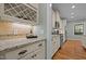 Elegant kitchen view featuring granite countertops, tile backsplash and stainless appliances at 1209 Kingston Ridge Rd, Cary, NC 27511