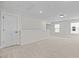 Bright bonus room with neutral carpet, recessed lighting, and white trim at 1236 Cricket St, Elon, NC 27244