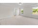 Spacious bedroom featuring neutral carpet, trim, and ceiling at 1302 Cricket St, Elon, NC 27244