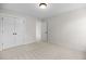 Bedroom with neutral carpet, modern trim, closet and window at 1302 Cricket St, Elon, NC 27244