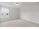 A bedroom with neutral carpet, modern trim and window with a view at 1302 Cricket St, Elon, NC 27244
