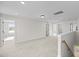 Upstairs bonus room with neutral carpet, recessed lighting, and bright view from the window at 1302 Cricket St, Elon, NC 27244
