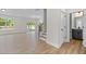 Open-concept living space featuring modern flooring and seamless flow to the outdoors at 1302 Cricket St, Elon, NC 27244