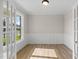 Versatile home office featuring French doors and natural light at 1302 Cricket St, Elon, NC 27244