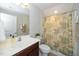 Well-maintained bathroom featuring a vanity, toilet, and a shower with decorative curtain at 1305 Chronicle Dr, Durham, NC 27703