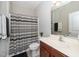 Functional bathroom with a shower-tub combo, toilet, and a vanity with a sink at 1305 Chronicle Dr, Durham, NC 27703