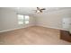 An inviting bedroom featuring neutral colors and a ceiling fan for added comfort at 1305 Chronicle Dr, Durham, NC 27703