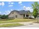 Lovely home showcasing a charming front porch, beautifully landscaped lawn, and a serene backyard view at 1305 Chronicle Dr, Durham, NC 27703