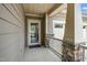 Charming covered front porch with stone accents and a welcoming entrance at 1305 Chronicle Dr, Durham, NC 27703